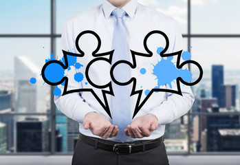 businessman holding puzzle