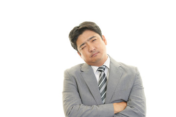 疲れた表情のビジネスマン