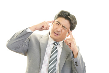 頭痛を訴えるビジネスマン