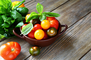 Tomatoes and basil in a bowl