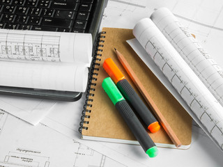Architectural blueprint of office building with a pencil ,notebo