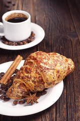 Croissant with cheese and coffee