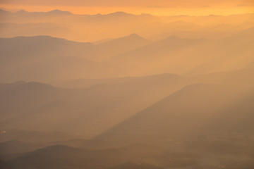 Mountain layer with the golden sunlight