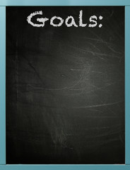 Goals written on a framed blackboard