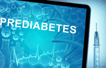 the word prediabetes on a tablet with syringe