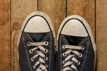 Gumshoes on wooden background