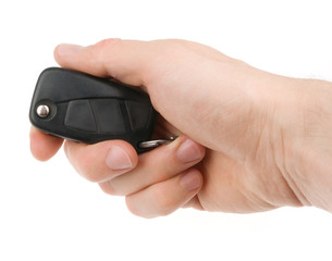 Hand holding car keys isolated on white background