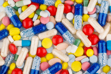 Color pills and capsules background