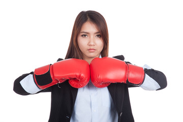 Young Asian businesswoman with boxing glove