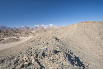 Rocky desert landscape with mountains
