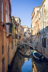 Fototapeta na wymiar Small canal in the Venice, Italy