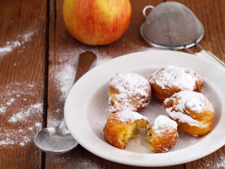 Homemade fritters on wooden background