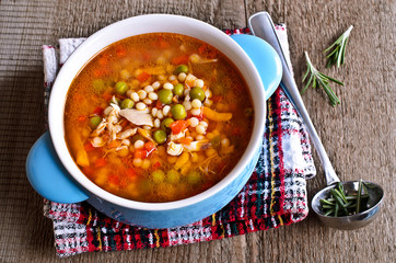 Soup with small pasta, vegetables and pieces of meat