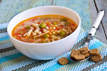 Soup with small pasta, vegetables and pieces of meat