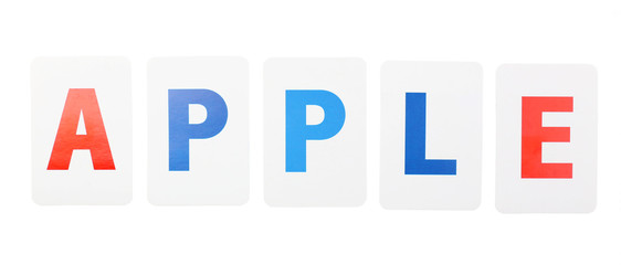 Apple word formed by educational paper cards isolated on white