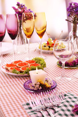 Buffet table with dishware waiting for guests