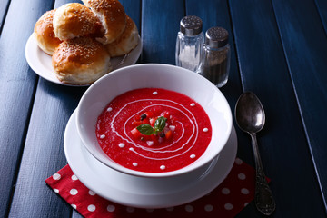 Gazpacho soup on color wooden background