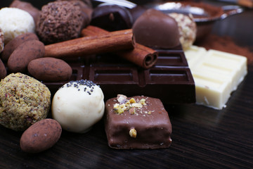 Bars of chocolate and round sweet truffles