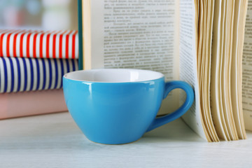 Color cup of tea with books