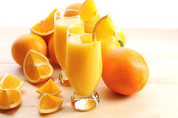 Freshly squeezed orange juice on wooden table
