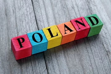 Foto op Plexiglas word poland on colorful wooden cubes © chrupka