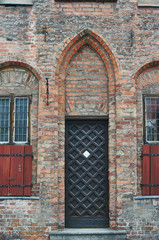 gothic door in medieval building in Torun, Poland.
