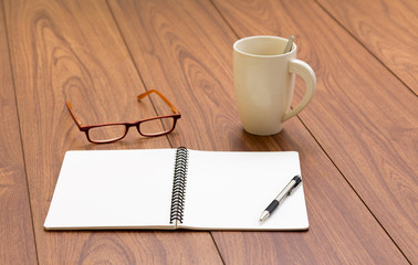 Blank ring binder notebook on wood background
