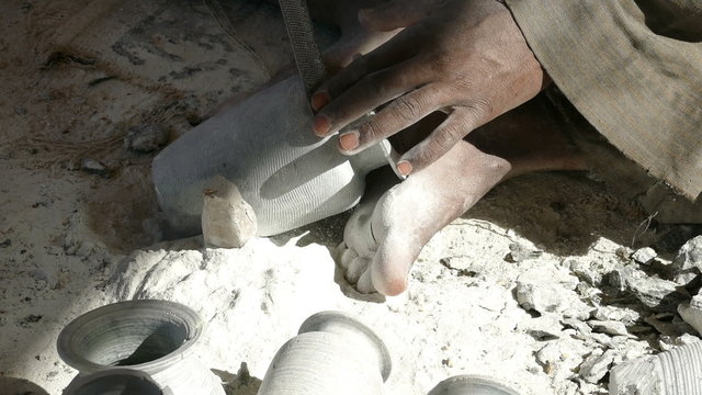 hands of a master, making the ceramic jug