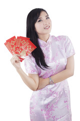 Chinese girl holding traditional envelope