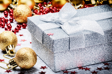 Christmas ornaments and present in silver  box