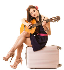 Music lover, summer girl with guitar and suitcase