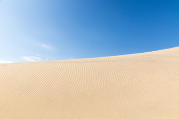 Blue sky and sand dunes. Sunny day.