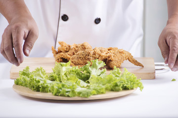 Chef presented Fried chicken, burger and french fries