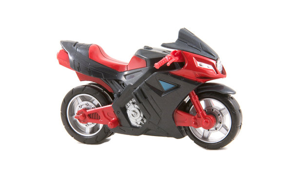 Fototapeta A small toy motorcycle isolated on white background