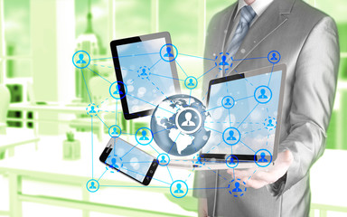 Obraz na płótnie Canvas Business man using tablet PC and smartphone social connection