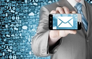 A man holding smartphone with one new message on a screen.