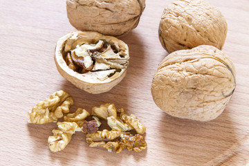Walnuts on rustic  wooden table