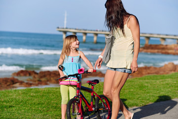 Fototapeta na wymiar riding bike beach child