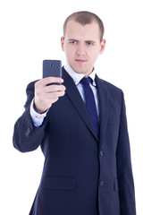 business man taking photos with mobile camera isolated on white