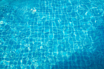 water with sun reflections in swim pool
