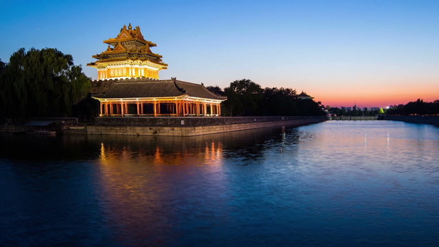 The scene of sunset at corner tower of Palace Museum, Beijing,