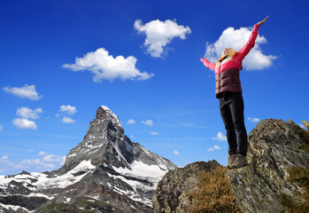 Girl on the top, in the background mount Matterhorn
