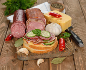 Sandwich with sausage and cucumber