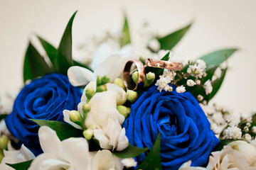 Beautiful wedding bouquet and wedding rings 