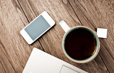 Office workplace with open laptop on wooden desk