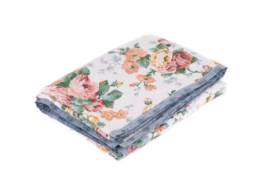 Stack of bedding set with flowers.