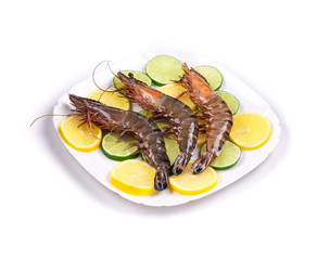 Raw tiger shrimps on plate.