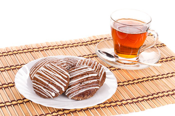 Cookies and tea composition on wood.
