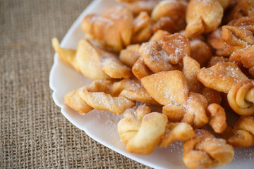 sweet pastry deep fried and sprinkled