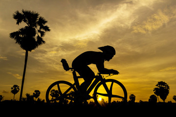 Fototapeta na wymiar Cycling on sunset